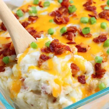 Cozy loaded baked potato casserole topped with cheese and bacon