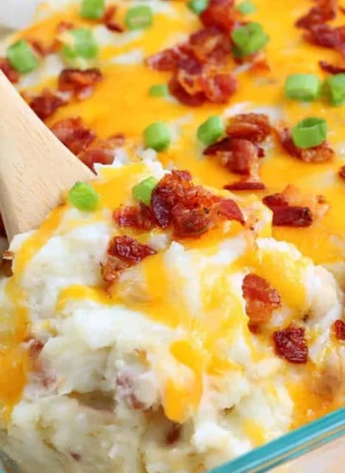 Cozy loaded baked potato casserole topped with cheese and bacon