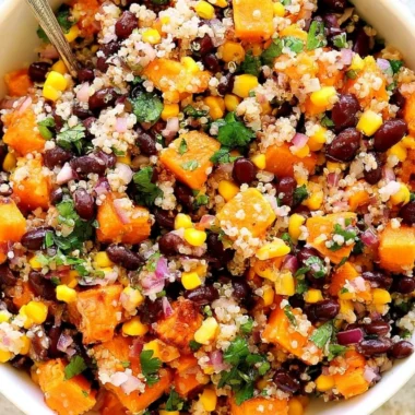 Cozy roasted sweet potato quinoa salad with colorful vegetables
