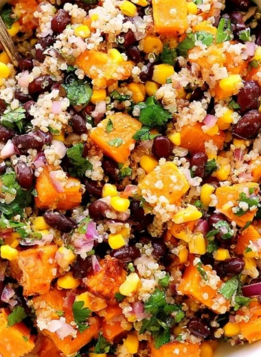 Cozy roasted sweet potato quinoa salad with colorful vegetables