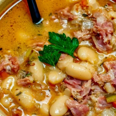 Crock Pot ham bone and bean soup garnished with herbs