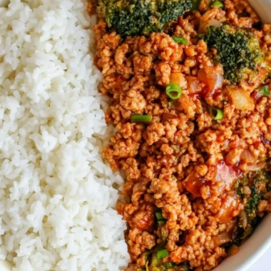 Firecracker ground chicken dish garnished with fresh herbs