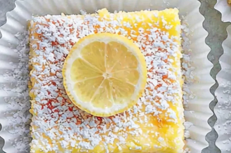 Delicious lemon cream cheese bars with a creamy lemon topping and a buttery crust