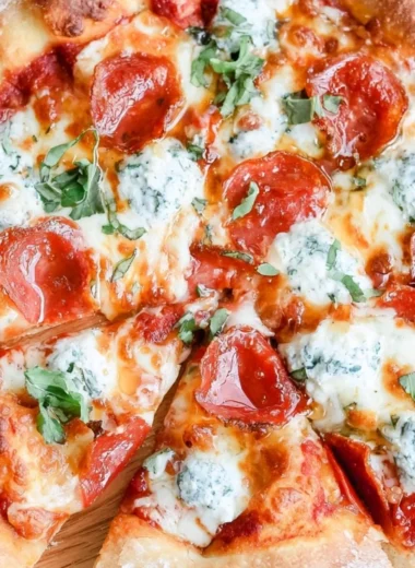 Delicious hot honey pizza topped with cheese and spicy drizzles.