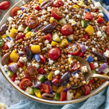 Colorful marinated lentil salad featuring fresh vegetables and herbs