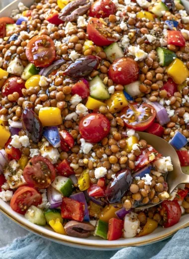 Colorful marinated lentil salad featuring fresh vegetables and herbs