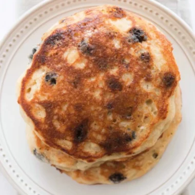 Fluffy and delicious sourdough pancakes stacked on a plate