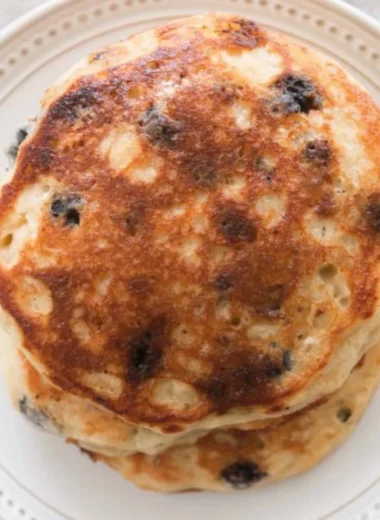 Fluffy and delicious sourdough pancakes stacked on a plate