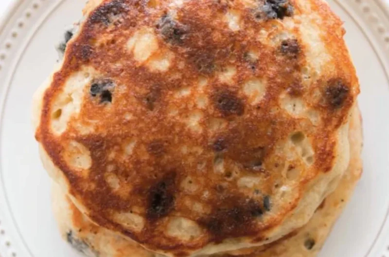 Fluffy and delicious sourdough pancakes stacked on a plate