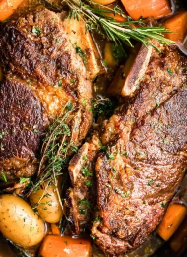Slow cooker pork roast served with vegetables and gravy