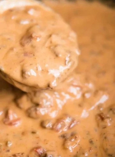 Delicious slow cooker queso dip served in a bowl with tortilla chips