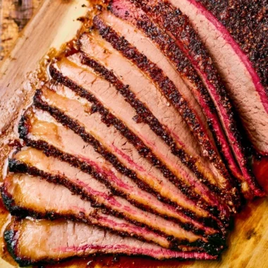 Perfectly smoked brisket on a pellet grill, showcasing juicy and flavorful meat.