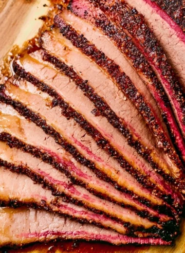 Perfectly smoked brisket on a pellet grill, showcasing juicy and flavorful meat.