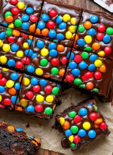 Delicious Sourdough Cosmic Brownies with chocolate glaze and colorful sprinkles