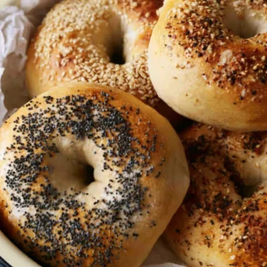 Freshly baked sourdough discard bagels on a cooling rack
