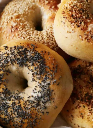 Freshly baked sourdough discard bagels on a cooling rack