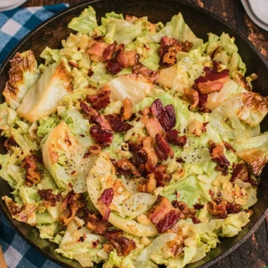 Southern Fried Cabbage with Crispy Bacon served in a skillet