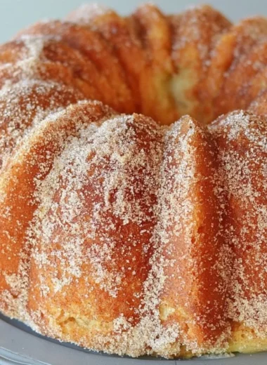 Moist Apple Cider Bundt Cake with a rich caramel apple glaze on top