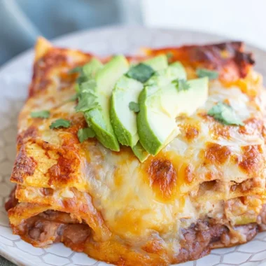 Cozy Bean and Cheese Enchilada Casserole served in a baking dish