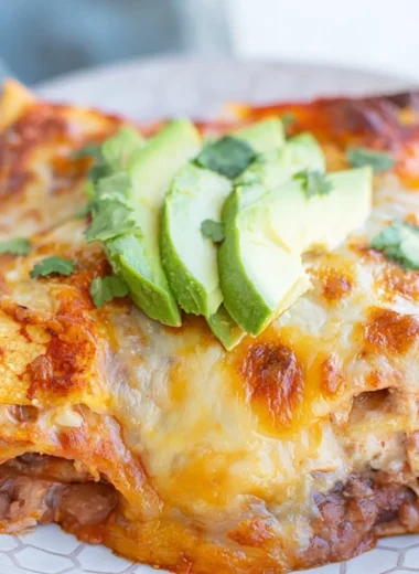 Cozy Bean and Cheese Enchilada Casserole served in a baking dish
