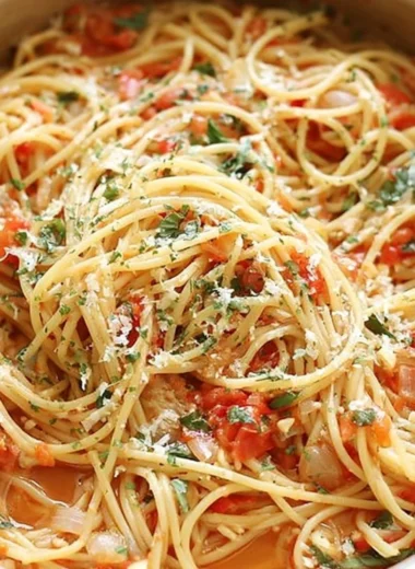 Delicious cozy one pot pasta dish garnished with herbs and served in a bowl