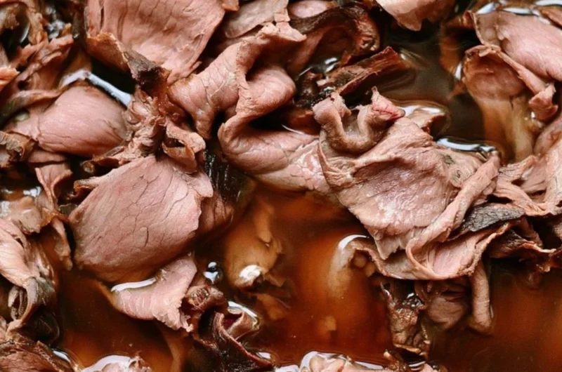 Easy French Dip Sandwich with roast beef and provolone cheese on a plate