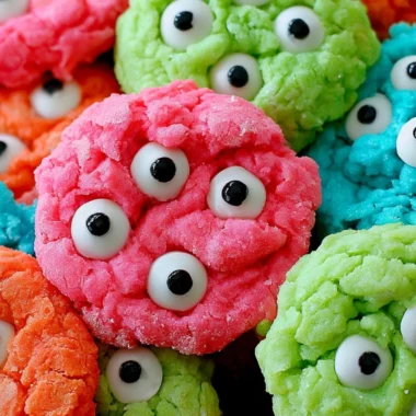 Gooey monster cookies filled with chocolate chips and colorful candies