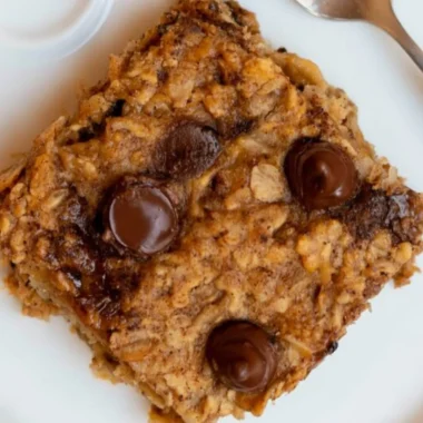 Delicious banana oatmeal bars stacked on a wooden table