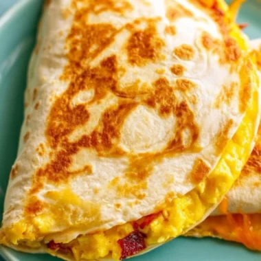 Delicious breakfast quesadilla made with eggs and cheese, served hot.
