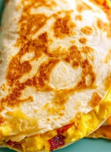 Delicious breakfast quesadilla made with eggs and cheese, served hot.