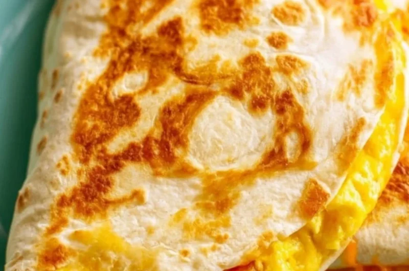 Delicious breakfast quesadilla made with eggs and cheese, served hot.