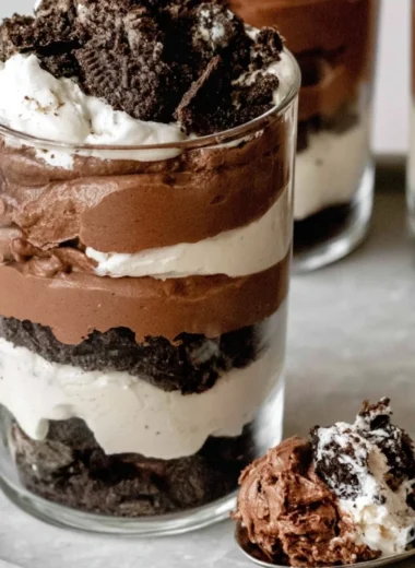 Delicious no-bake Chocolate Parfait layered with creamy chocolate and topped with berries