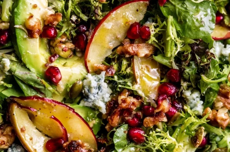 Colorful Christmas Salad topped with honey mustard dressing in a festive bowl.