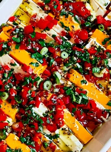 Delicious marinated cheese served as an appetizer with herbs and spices.