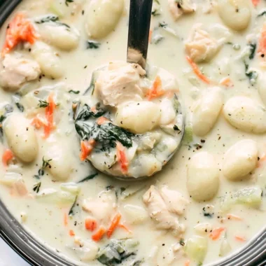 Bowl of Olive Garden Chicken Gnocchi Soup with vegetables and chicken