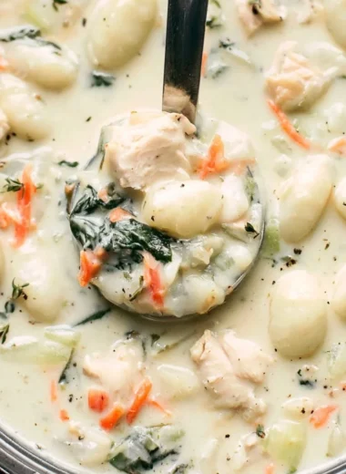 Bowl of Olive Garden Chicken Gnocchi Soup with vegetables and chicken