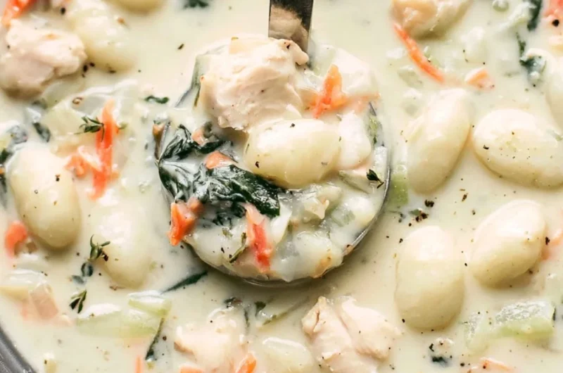 Bowl of Olive Garden Chicken Gnocchi Soup with vegetables and chicken
